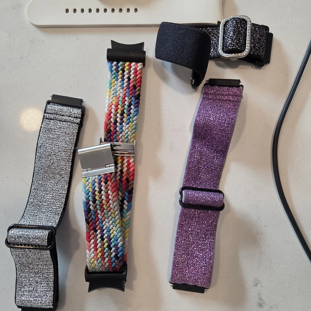 Versatile White Smartwatch with Multiple Bands